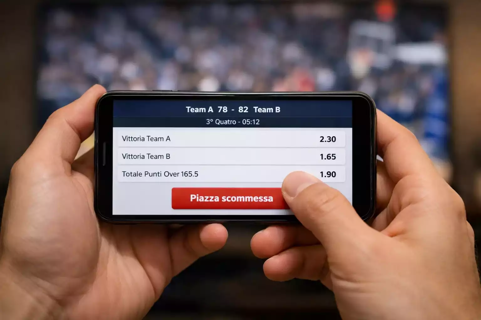 Smartphone con app di scommesse durante una partita